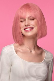 Beautiful funny cute woman in pink wig and classic makeup