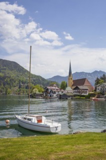 Church of St Laurentius and sailing boat with Tegernsee