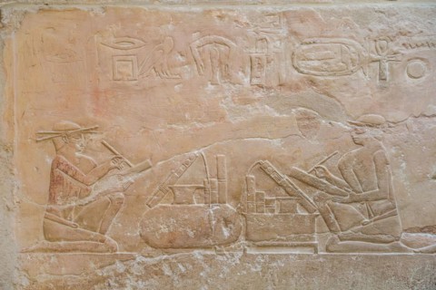 Scribe with papyrus scrolls