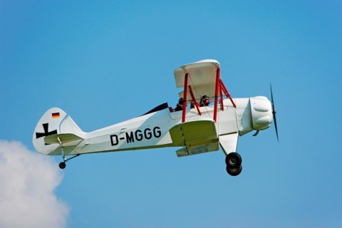 Pilot and co-pilot in a biplane