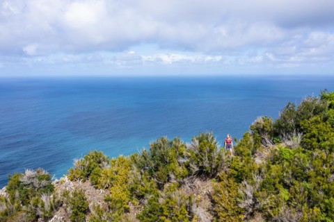 Hiker in front of the sea