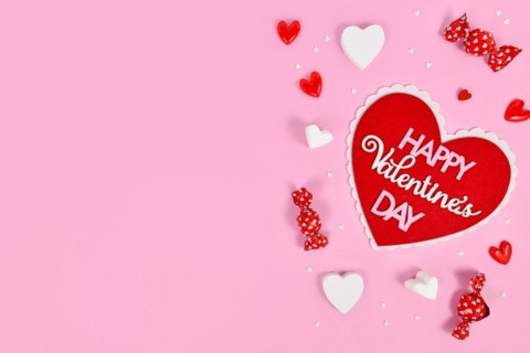 Pink Valentines Day flat lay with heart with text Happy Valentines Day