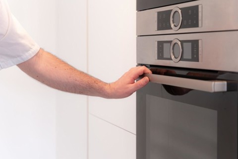 A man baker cooking a red velvet cake at home