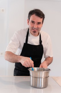 A man baker cooking a red velvet cake at home