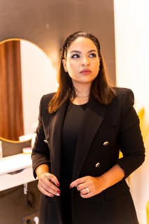 Woman of Latin ethnicity in an aesthetic store of eyebrows and nails