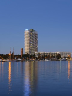 Old lighthouse and Hotel Maritim on the Trave promenade
