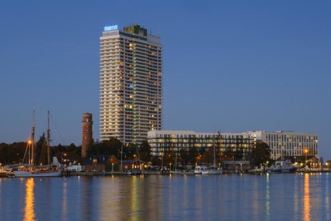 Old lighthouse and Hotel Maritim on the Trave promenade