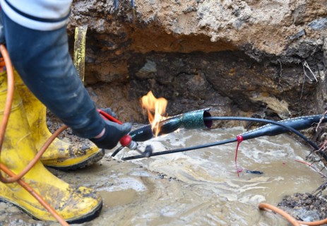 Worker repairs a telephone line