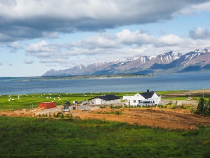 View over Eyjafoerour to the snow-capped mountains near Dalvik