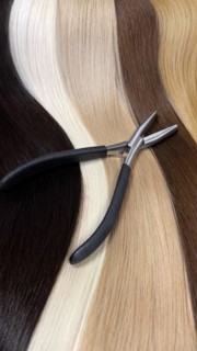 Strands of natural hair in different colors for extensions with tools