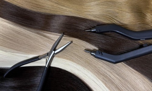 Strands of natural hair in different colors for extensions with tools