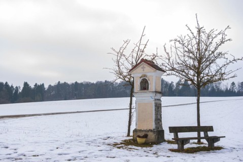 Catholic wayside shrine on the Swabian Alb in winter
