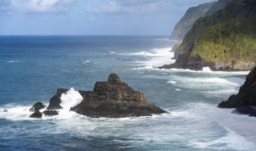 View of steep cliffs and coast with sea