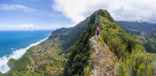 Hiker on the ridge of Pico do Alto