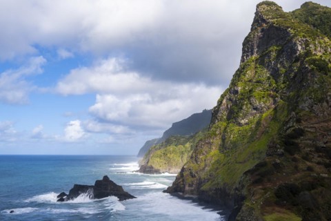 View of steep cliffs and coast with sea