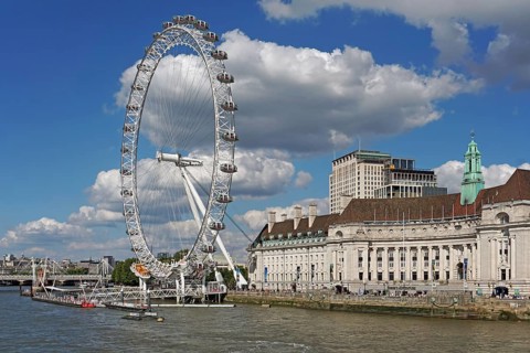 The London Eye Ferris Wheel and County Hall on the banks of the Thames
