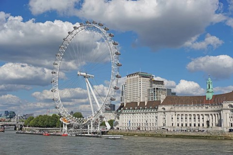 The London Eye Ferris Wheel and County Hall on the banks of the Thames