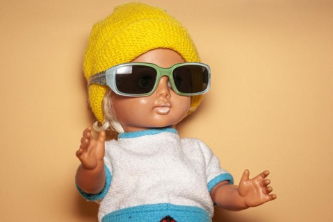 Cool doll with sunglasses and yellow knitted cap