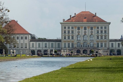 Nymphenburg Palace Palace with water surface against a blue sky