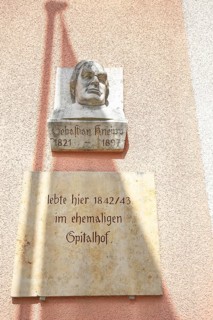 Bust of Sebastian Kneipp at the town hall in the old town of Bad Groenenbach in fine weather