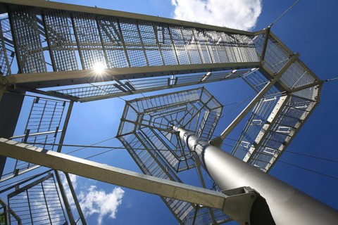 Steel observation tower and suspension bridge on the Iller in fine weather