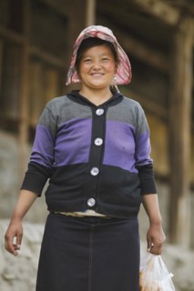 Laughing Tibetan woman with cap