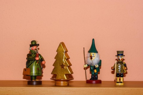 Christmas decoration consisting of three incense smokers and a candle in the shape of a fir tree