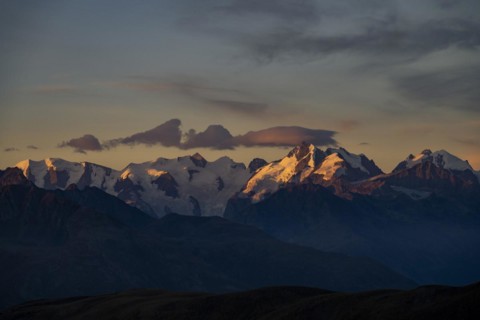 Summit of the Bernina Group with dramatic cloudy sky