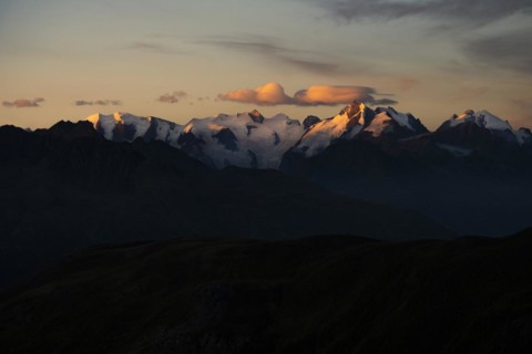 Summit of the Bernina Group with dramatic cloudy sky