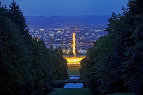 Bergpark Wilhelmshoehe with the view over the central park axis to Kassel in the blue hour