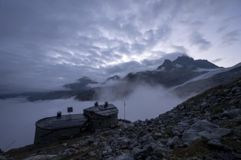 Chamanna Coaz mountain hut above the Val Rosegg valley at blue hour