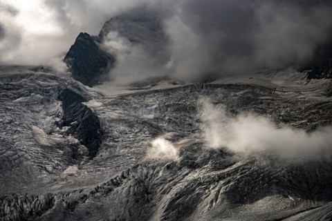 Bernina Group with Rosegg Glacier and dramatic clouds at blue hour