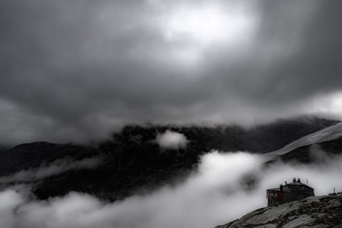 Chamanna Coaz mountain hut above the Val Rosegg valley at blue hour
