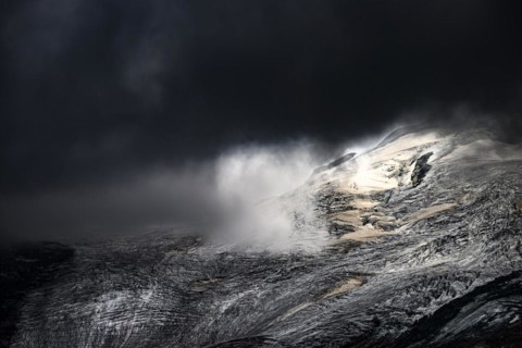 Bernina Group with Rosegg Glacier and dramatic clouds at blue hour