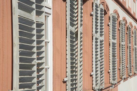 A row of shutters with louvres