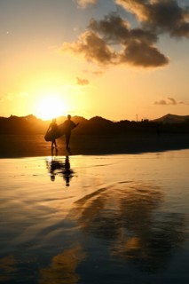 Sunset reflected on Caleta de Famara beach