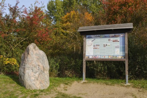 Information board and memorial stone at the former border to the GDR