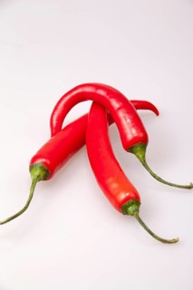 Three red chillies on top of each other