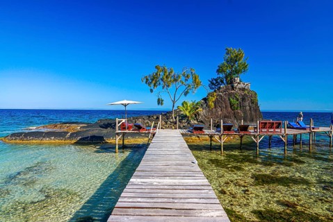 Pier to little islet on the coastline of the Island Ile Sainte Marie
