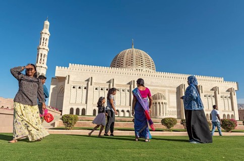 Indian family visiting Sultan Qaboos Grand Mosque