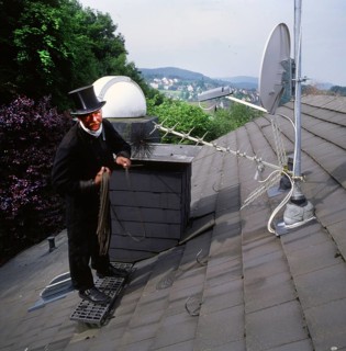 Chimney sweep in professional training and posing in a photo studio