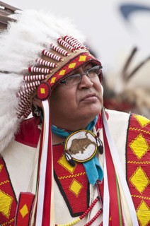 Native male elder in traditional regalia