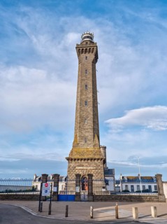 The historic lighthouse Phare dEckmuehl with the blue sky in the background