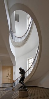 Foyer with free-swinging Art Nouveau staircase and Auguste Rodin's Eva