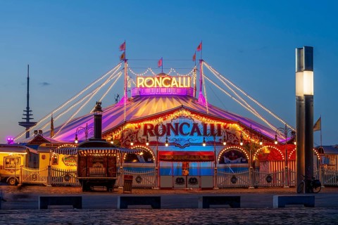 Circus Roncalli at dusk on the Buergerweide