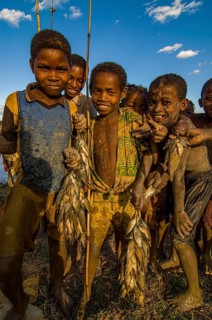 Young boys with their fresh caught fish