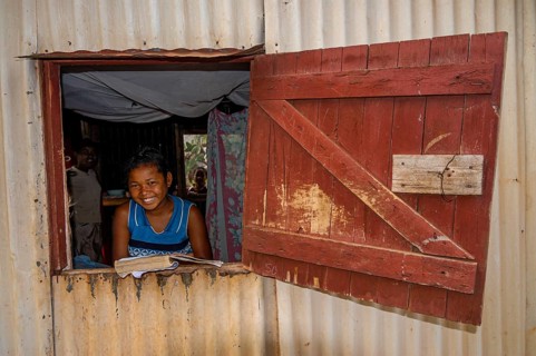Girl studying in a little hut