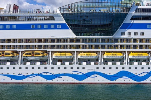 The cruise ship AIDAmar at the quay wall of the Warnemuende Cruise Center in the port of Rostock-Warnemuende
