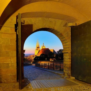 View through the Peterstor of the Petersberg Citadel of the Severi Church and Erfurt Cathedral at dawn