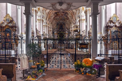 Harvest decoration in front of the baroque interior of the former monastery church of St. Margareta